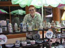 John Reiger at a Fair with his pottery